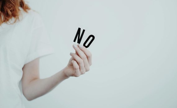 person holding an alphabet